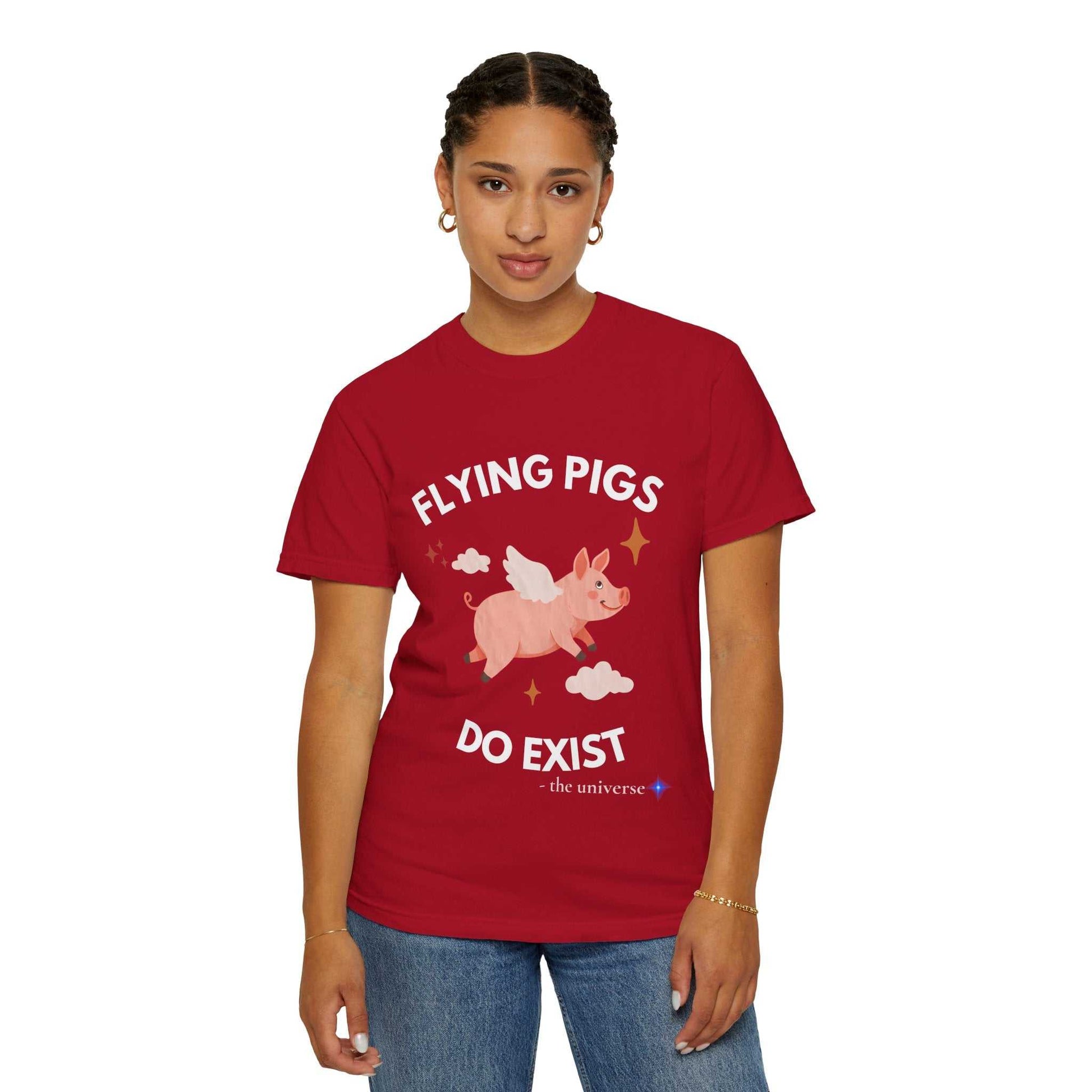 Red t-shirt with a graphic of a flying pig and text that says "Flying Pigs Do Exist".