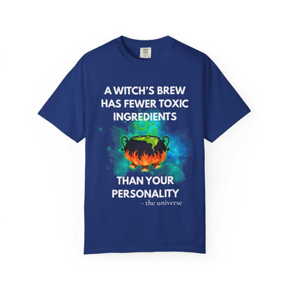 Blue t-shirt with a witch's cauldron design and text.