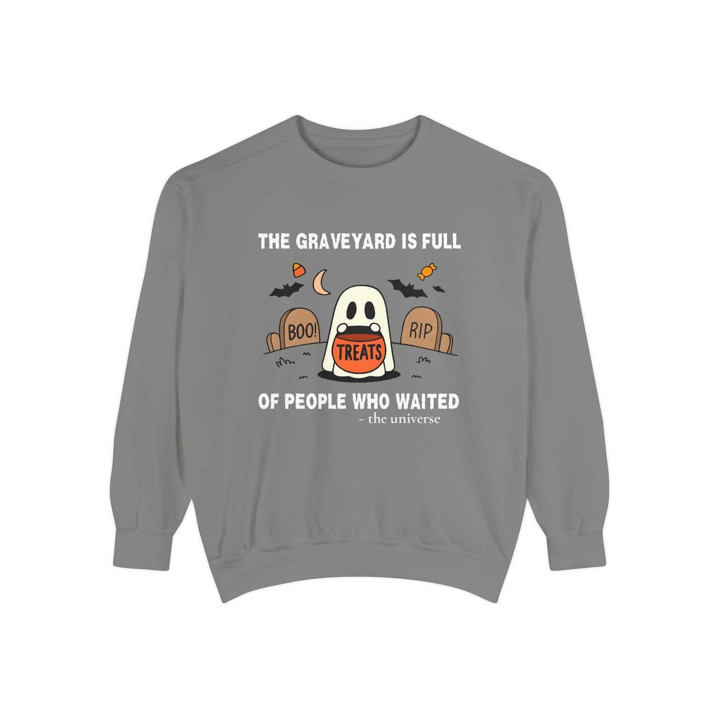 Sweatshirt with a ghost in a graveyard holding treats and Halloween text.