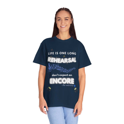 A woman wears a navy t-shirt with the text "Life is one long rehearsal, don't expect an encore."