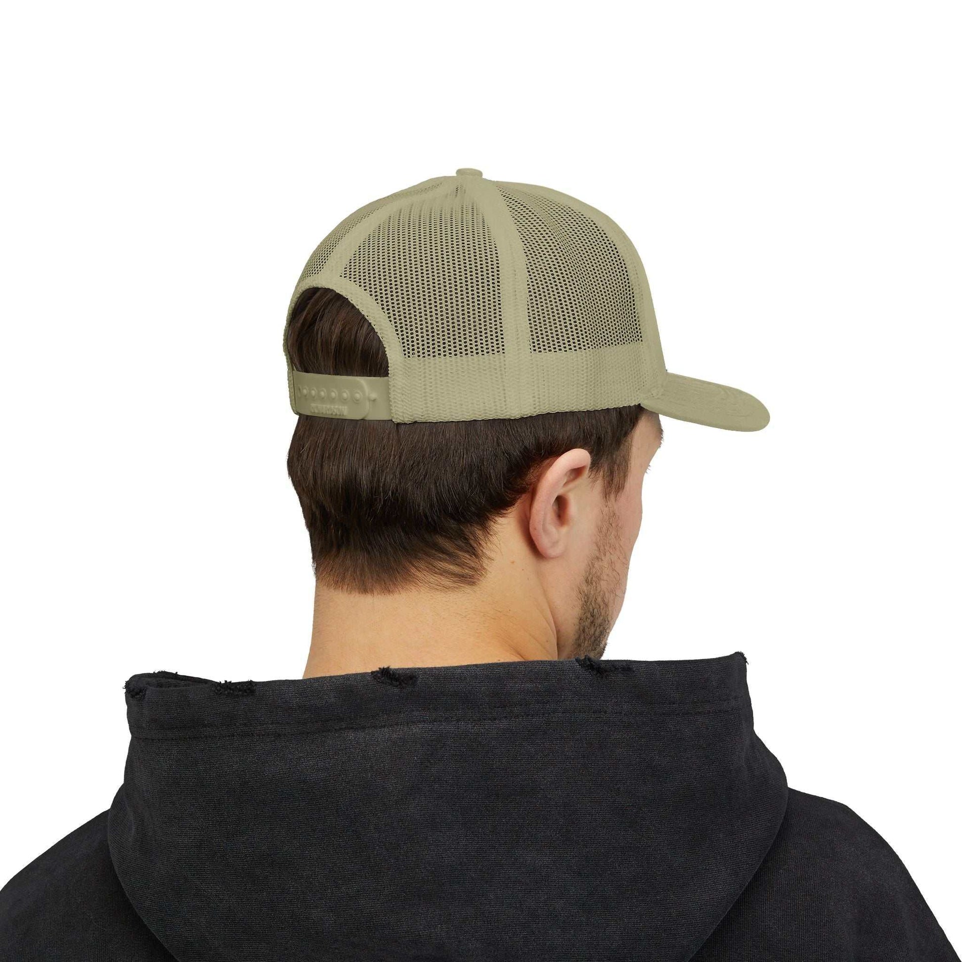 Beige Planet Smile trucker cap with mesh back and snapback closure worn by person