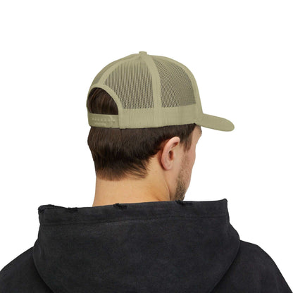 Beige Planet Smile trucker cap with mesh back and snapback closure worn by person