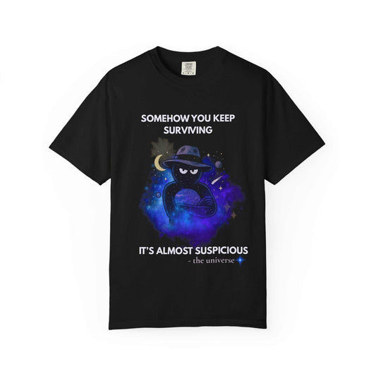 Black mysterious cat t-shirt with cosmic design and "Somehow You Keep Surviving" dark humor quote