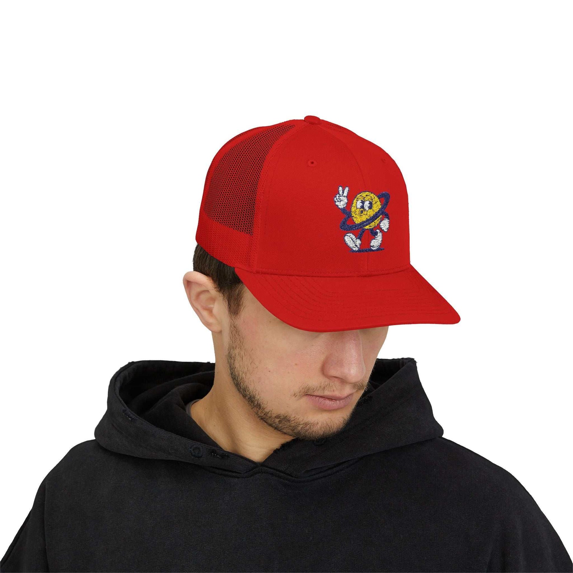 Red Planet Smile Trucker Cap with retro cartoon space patch and breathable mesh back on male model
