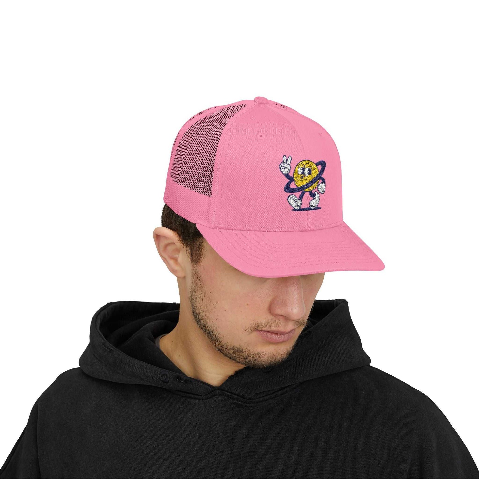 Pink Planet Smile Trucker Cap with retro cartoon space patch and breathable mesh back worn by man