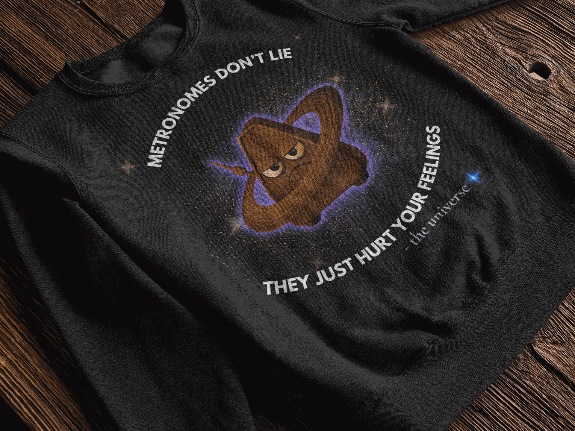 Black sweatshirt with a grumpy metronome in space and text.