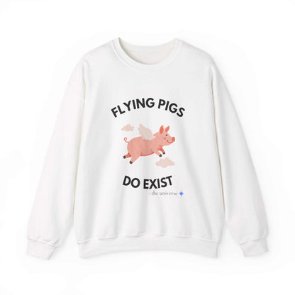 White sweatshirt with a flying pig illustration and "Flying Pigs Do Exist" text, cosmic-themed design, cozy cotton blend, unisex fit.