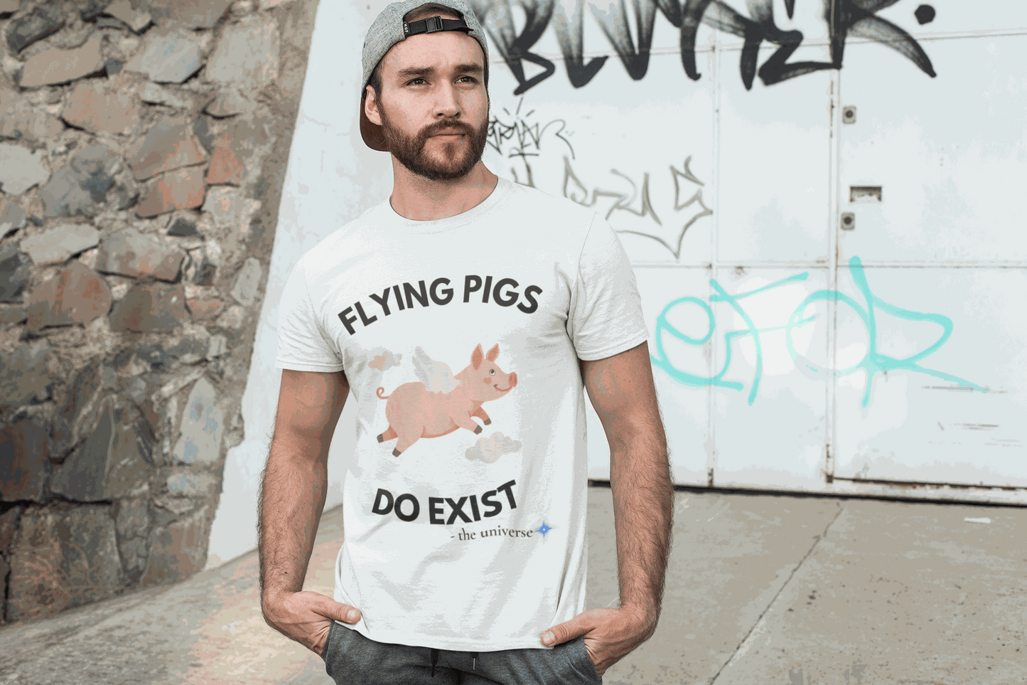 A white t-shirt with a graphic of a flying pig and the text "Flying Pigs Do Exist".