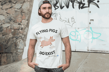A white t-shirt with a graphic of a flying pig and the text "Flying Pigs Do Exist".