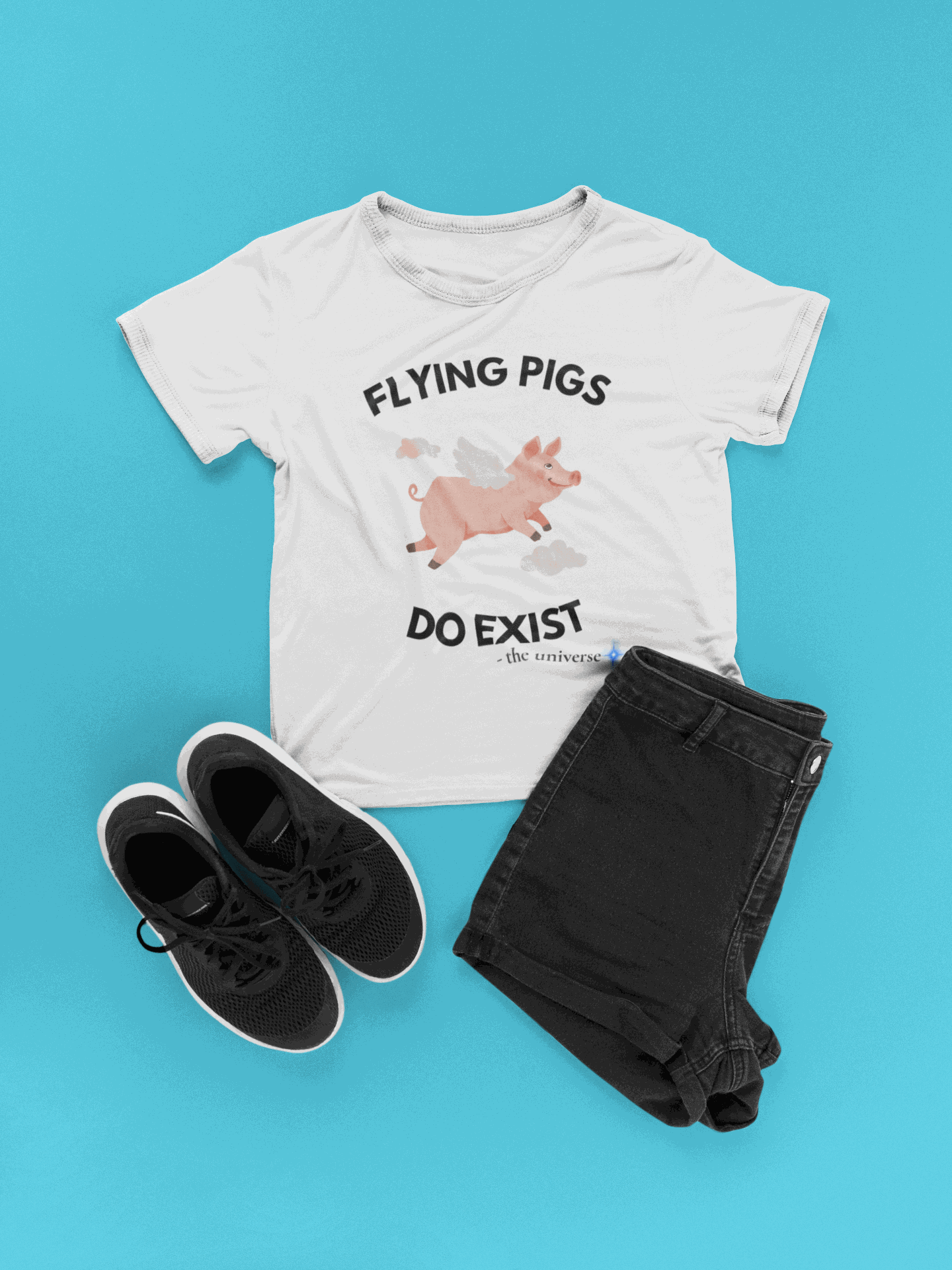 White t-shirt with a flying pig graphic and text that says "Flying Pigs Do Exist".