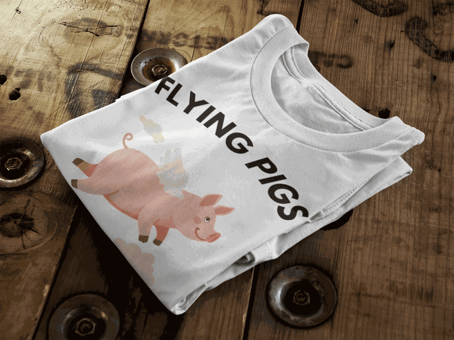 White t-shirt with a graphic of a flying pig and the text "FLYING PIGS".