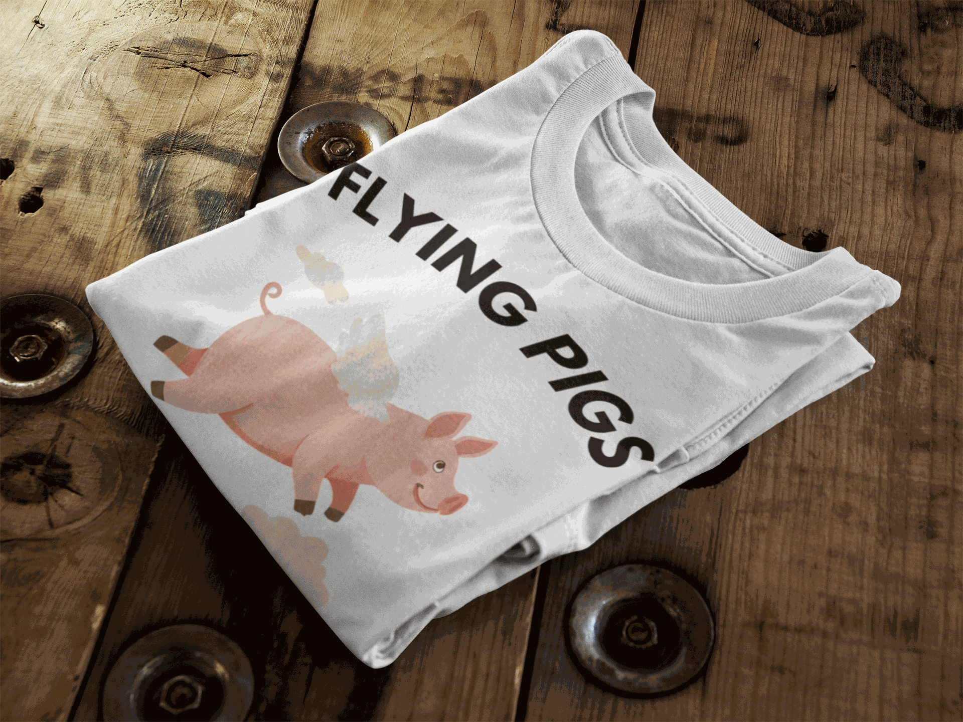 White t-shirt with a graphic of a flying pig and the text "FLYING PIGS".