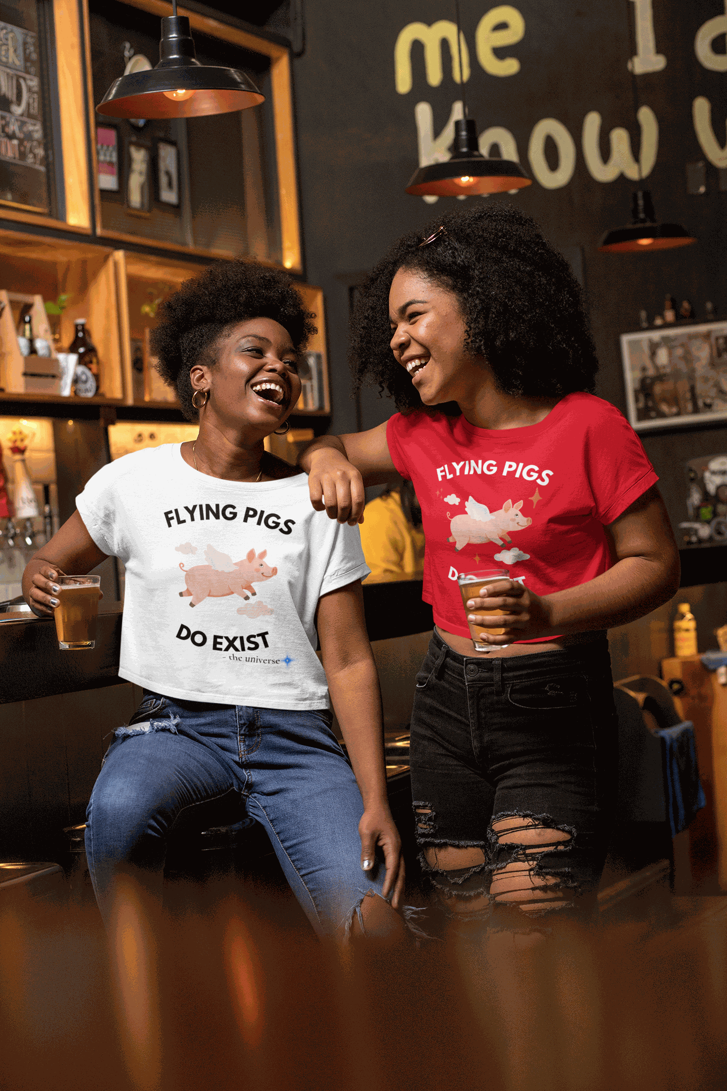 A white crop top with a graphic of a flying pig and the text "Flying Pigs Do Exist".