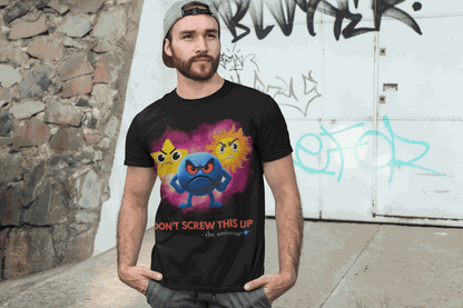 A black t-shirt with a graphic of three angry celestial emojis and the text "Don't Screw This Up - the universe".