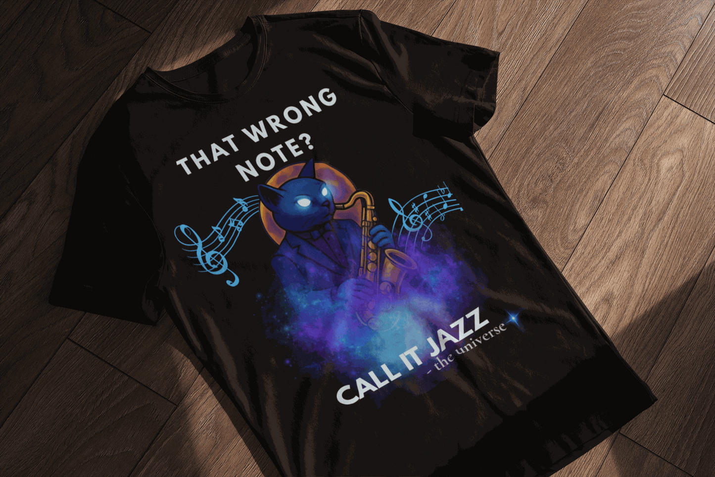 Black t-shirt with a blue cat playing a saxophone and musical notes.