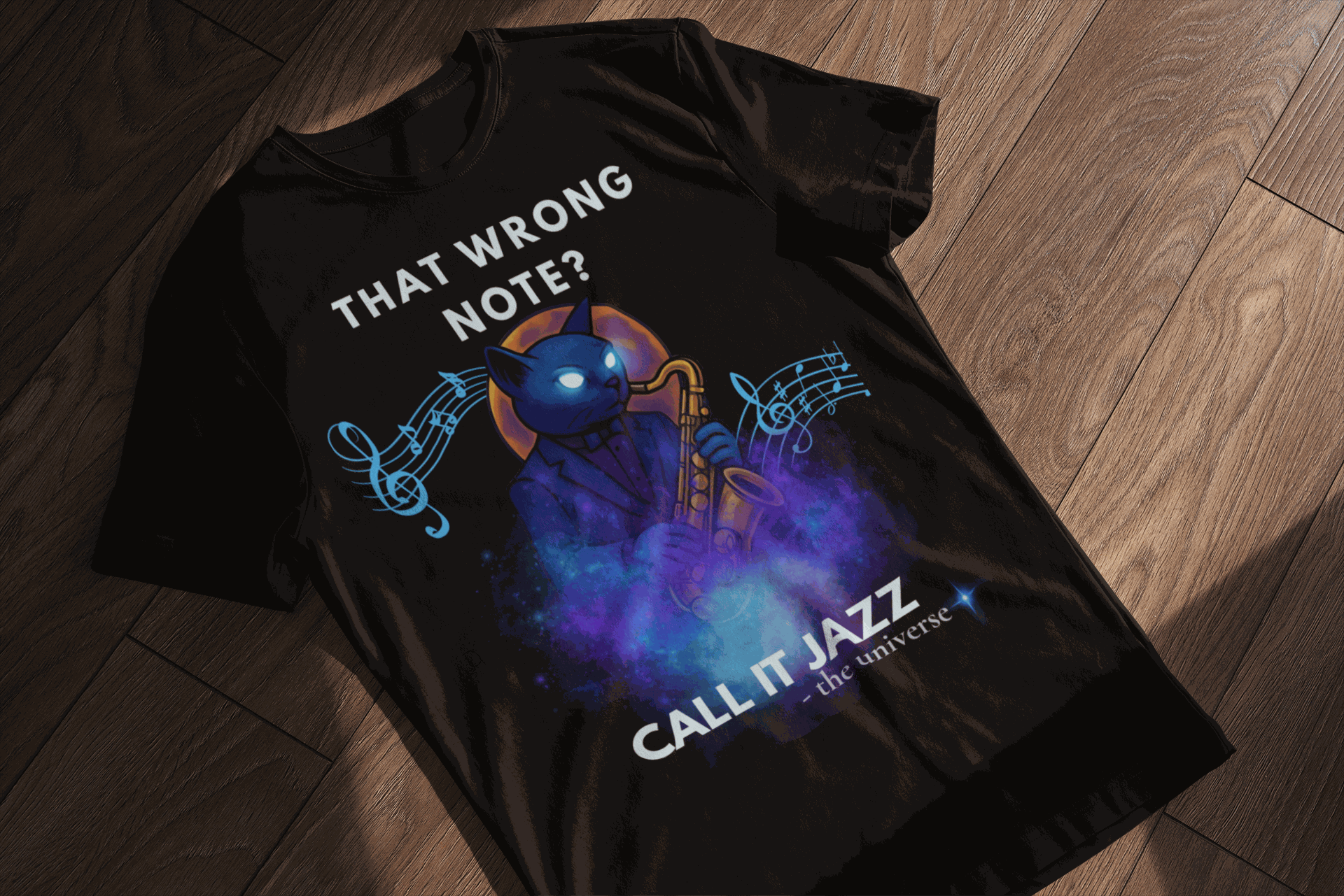 Black t-shirt with a blue cat playing a saxophone and musical notes.