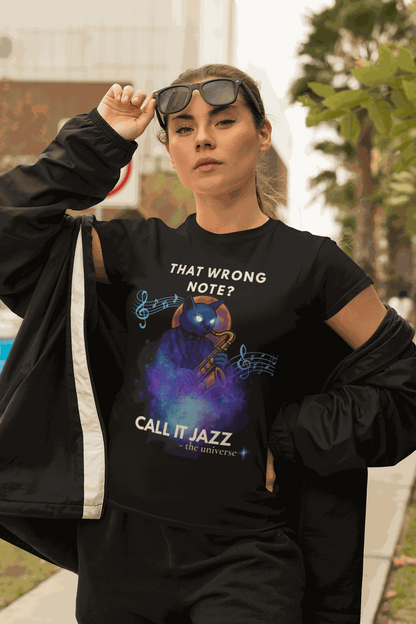 A woman wears a black t-shirt with a cosmic cat playing a saxophone and the text "That Wrong Note? Call It Jazz".