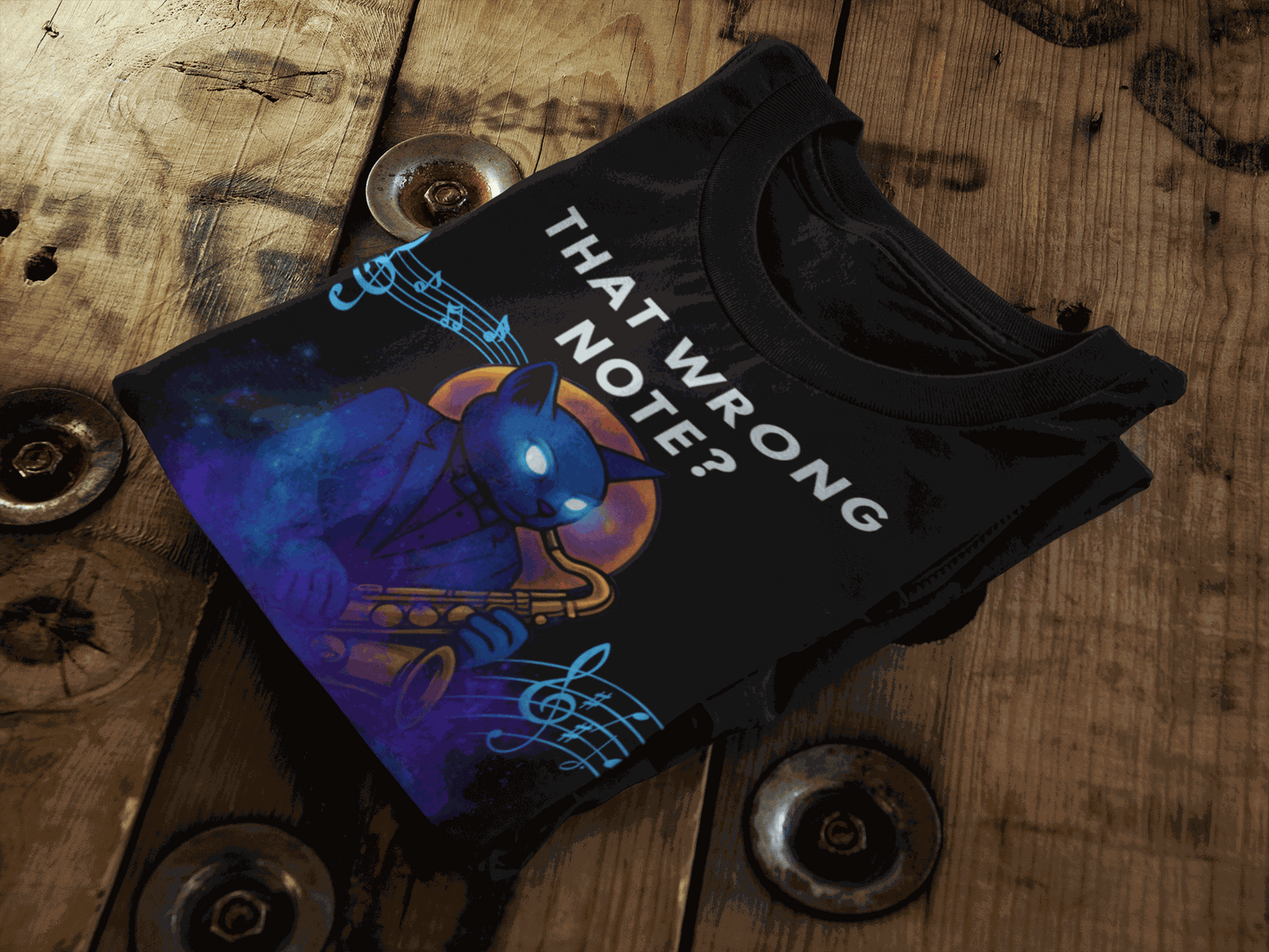 Black t-shirt with a blue cat playing a saxophone and musical notes.