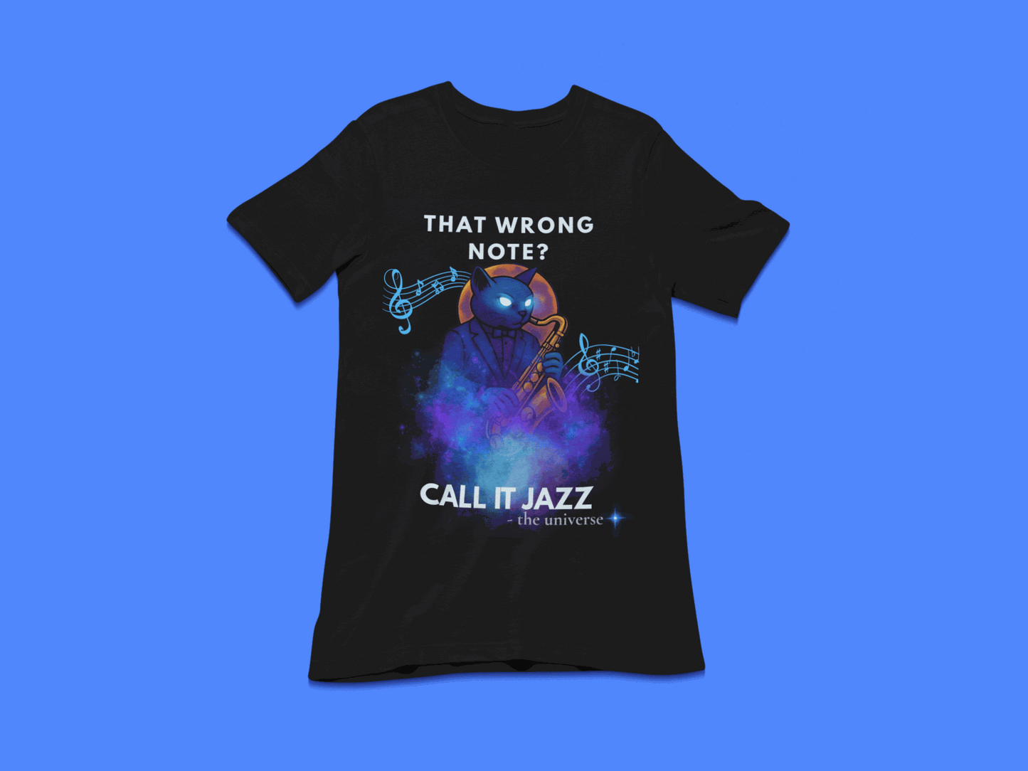 A black t-shirt with a cosmic cat playing a saxophone and the text "That Wrong Note? Call It Jazz".