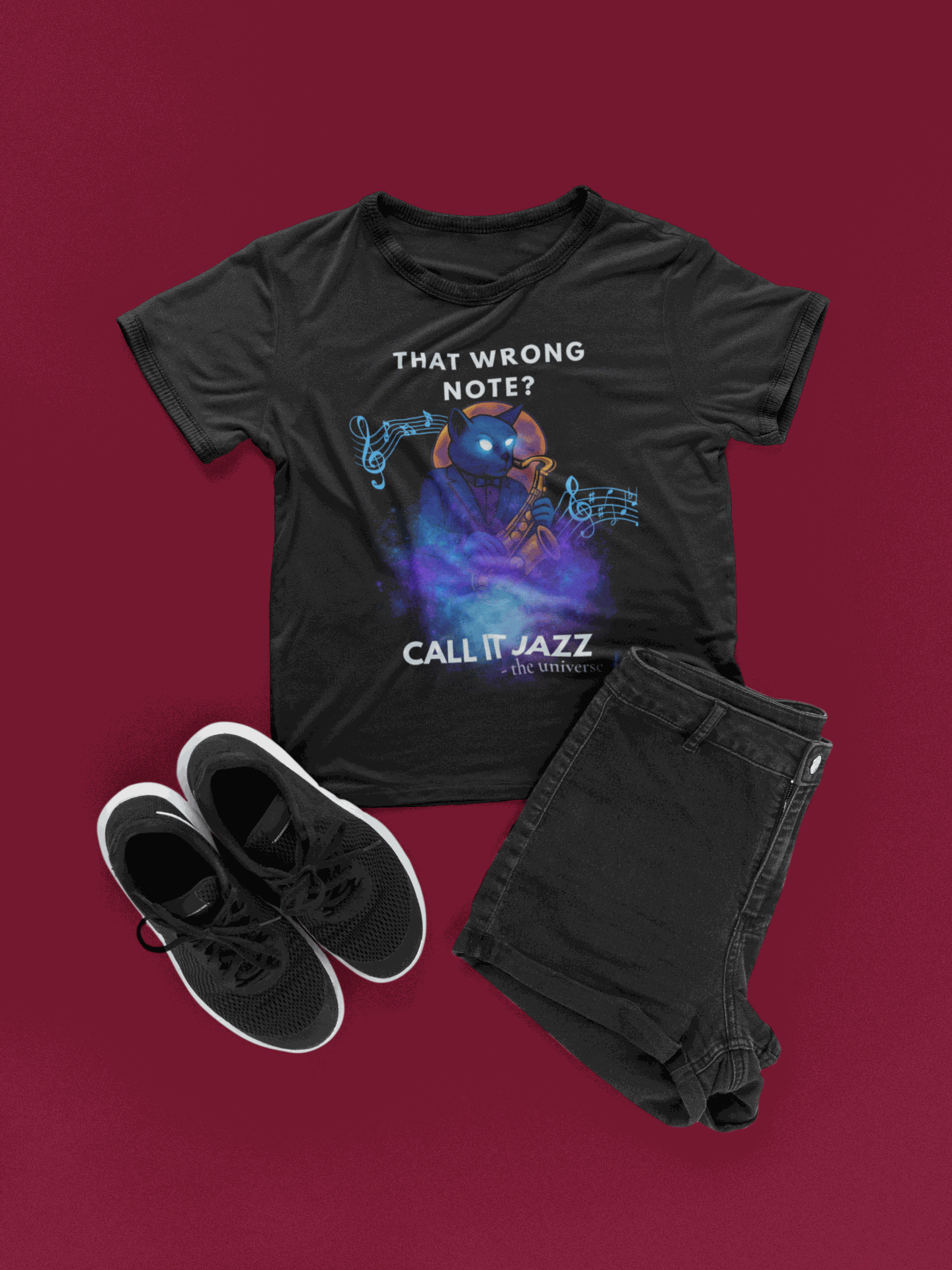 Black t-shirt with a cosmic cat playing a saxophone and musical notes.