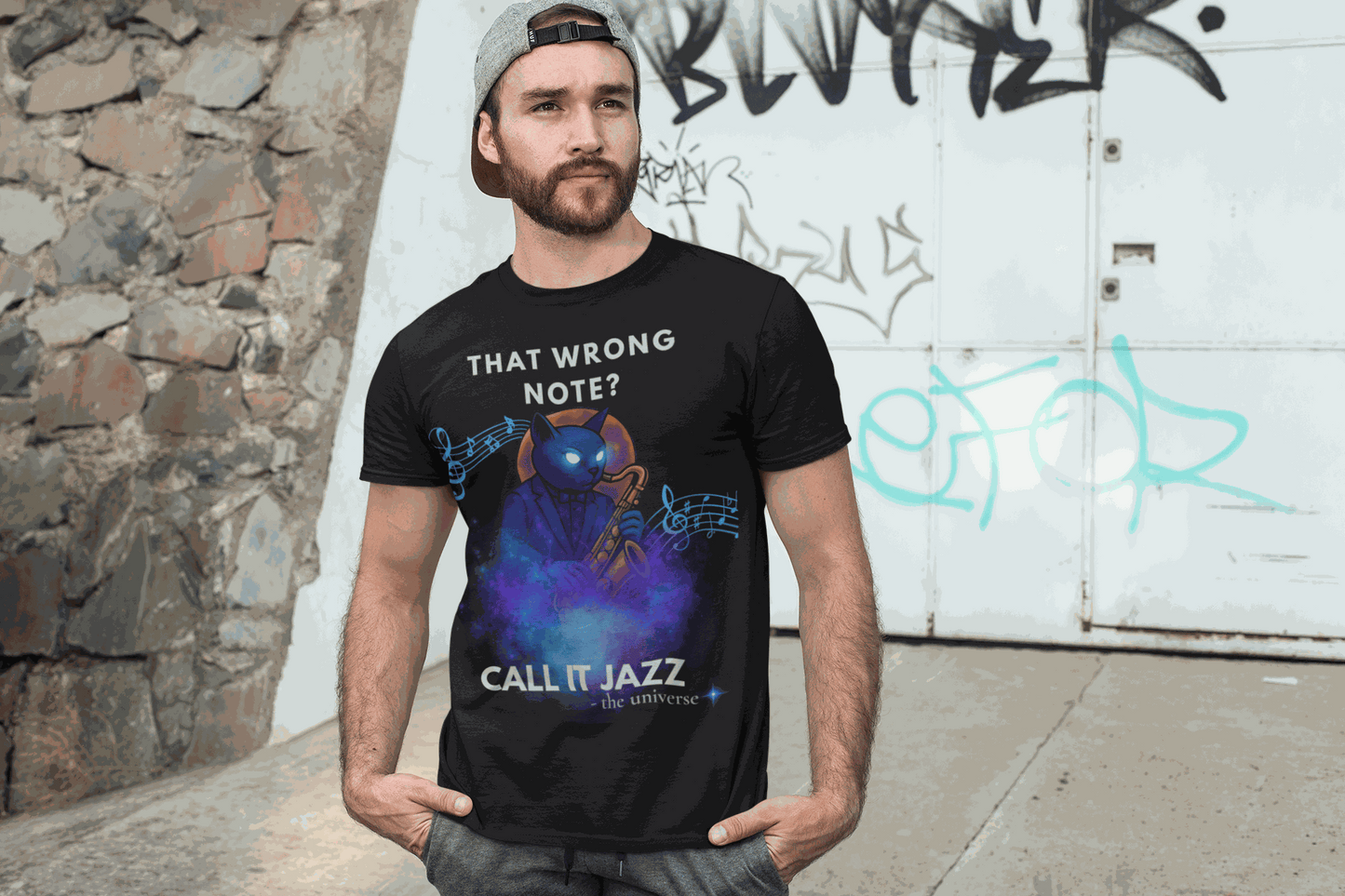 Black t-shirt with a blue cat playing a saxophone and musical notes.