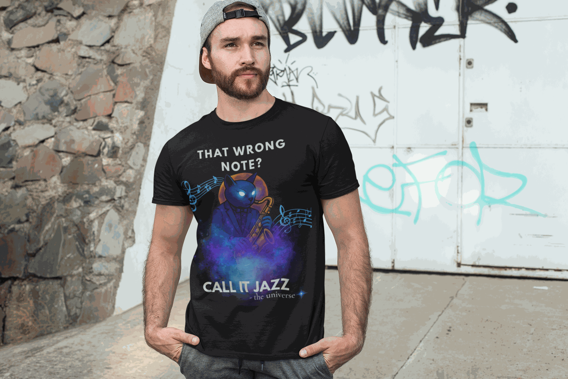 Black t-shirt with a blue cat playing a saxophone and musical notes.