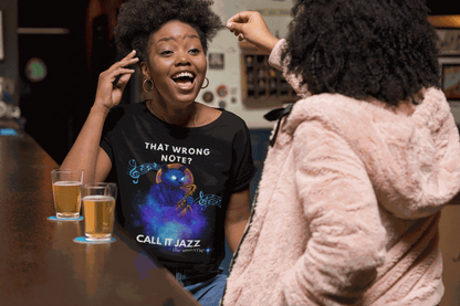 A black t-shirt with a cosmic cat playing a saxophone and the text "That Wrong Note? Call It Jazz".