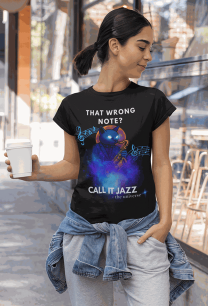 A woman wears a black t-shirt with a cosmic cat playing a saxophone and the text "That Wrong Note? Call It Jazz".