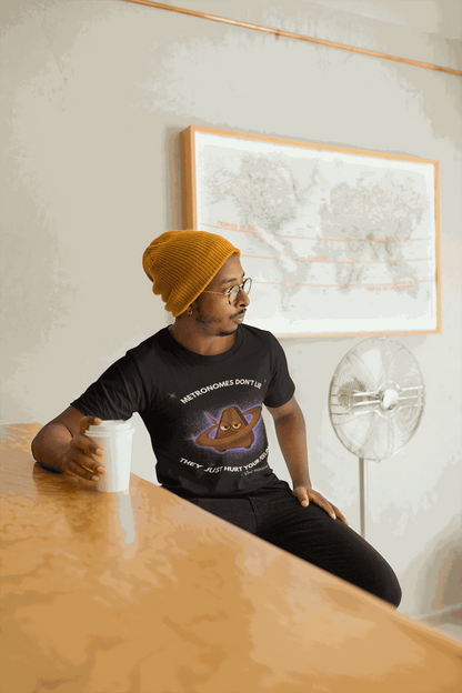 A man wears a black t-shirt with a graphic of an angry metronome in space.