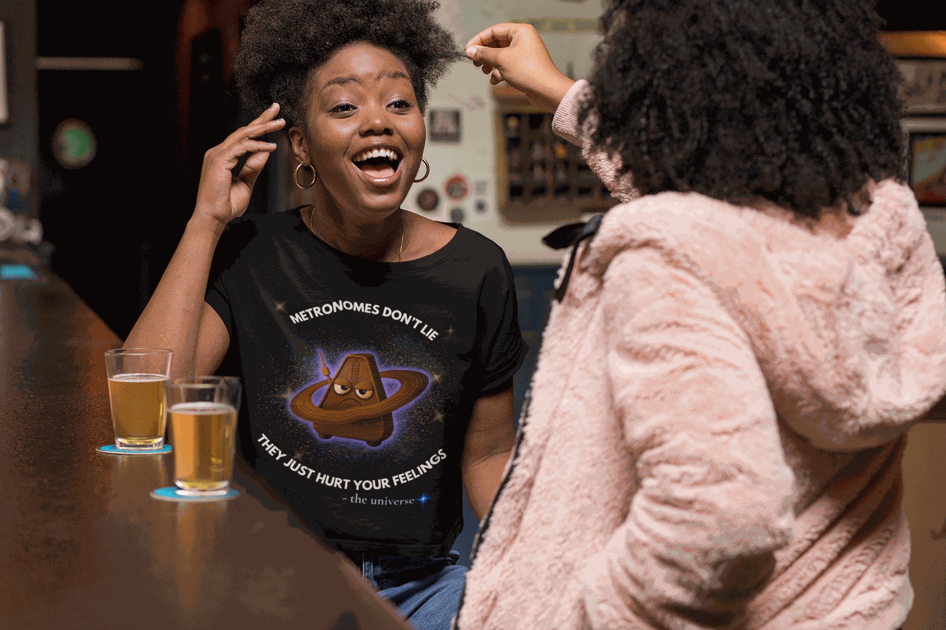 Black t-shirt with a graphic of an angry metronome in space.