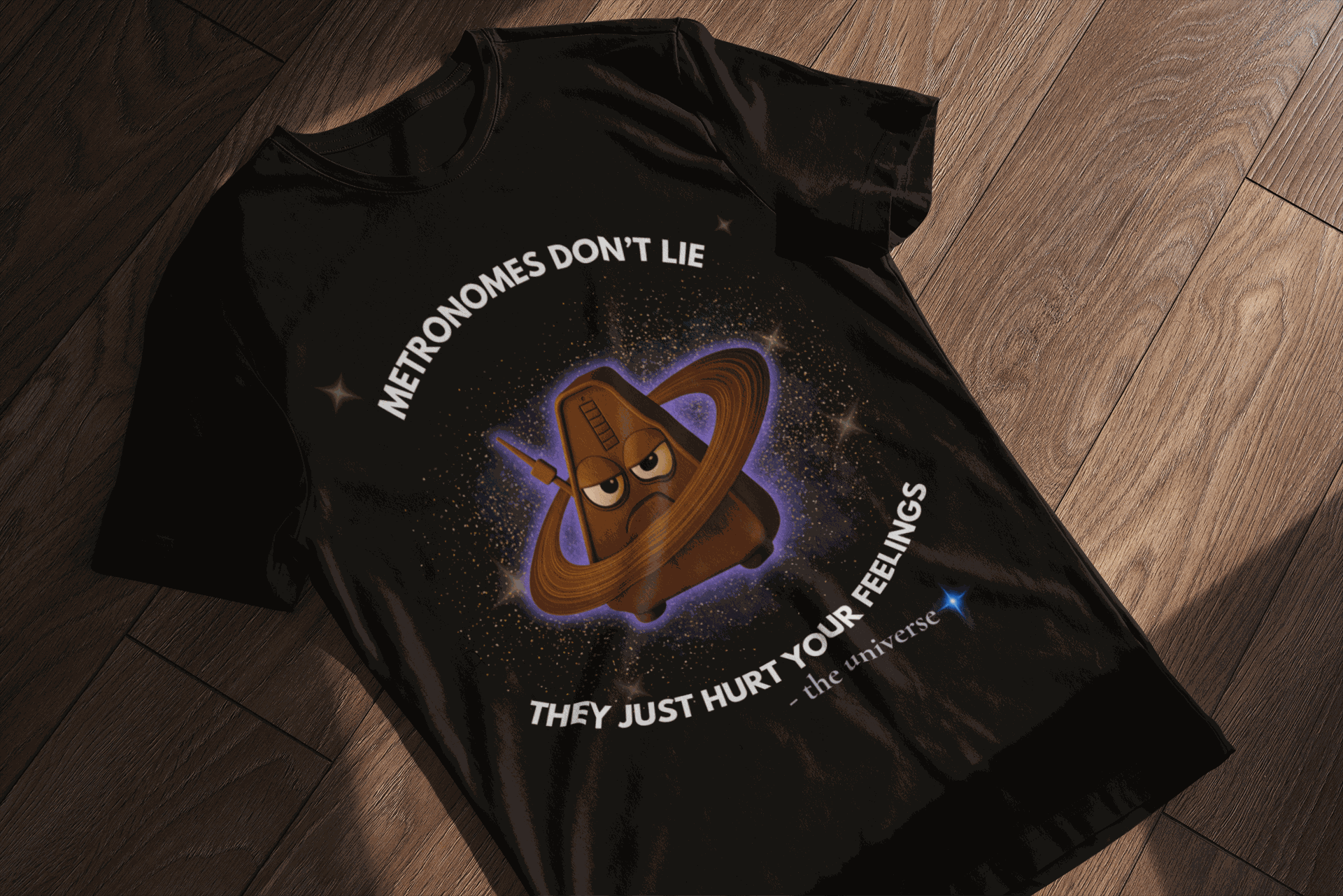A black t-shirt with a cartoon metronome in space and the text "Metronomes Don't Lie".