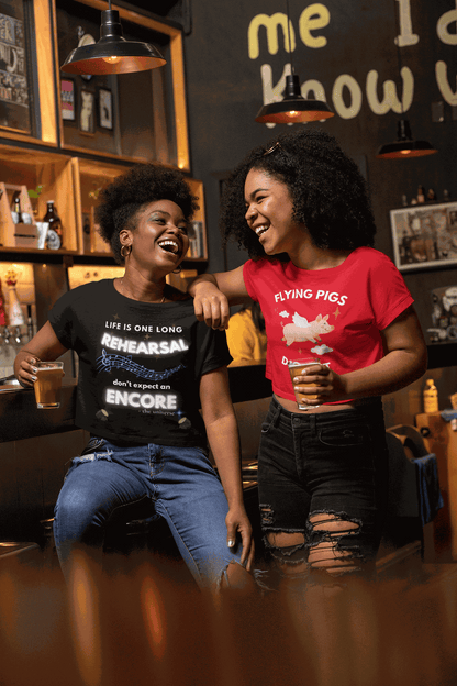 Black t-shirt with white text and musical notes that reads "Life is one long rehearsal don't expect an encore".