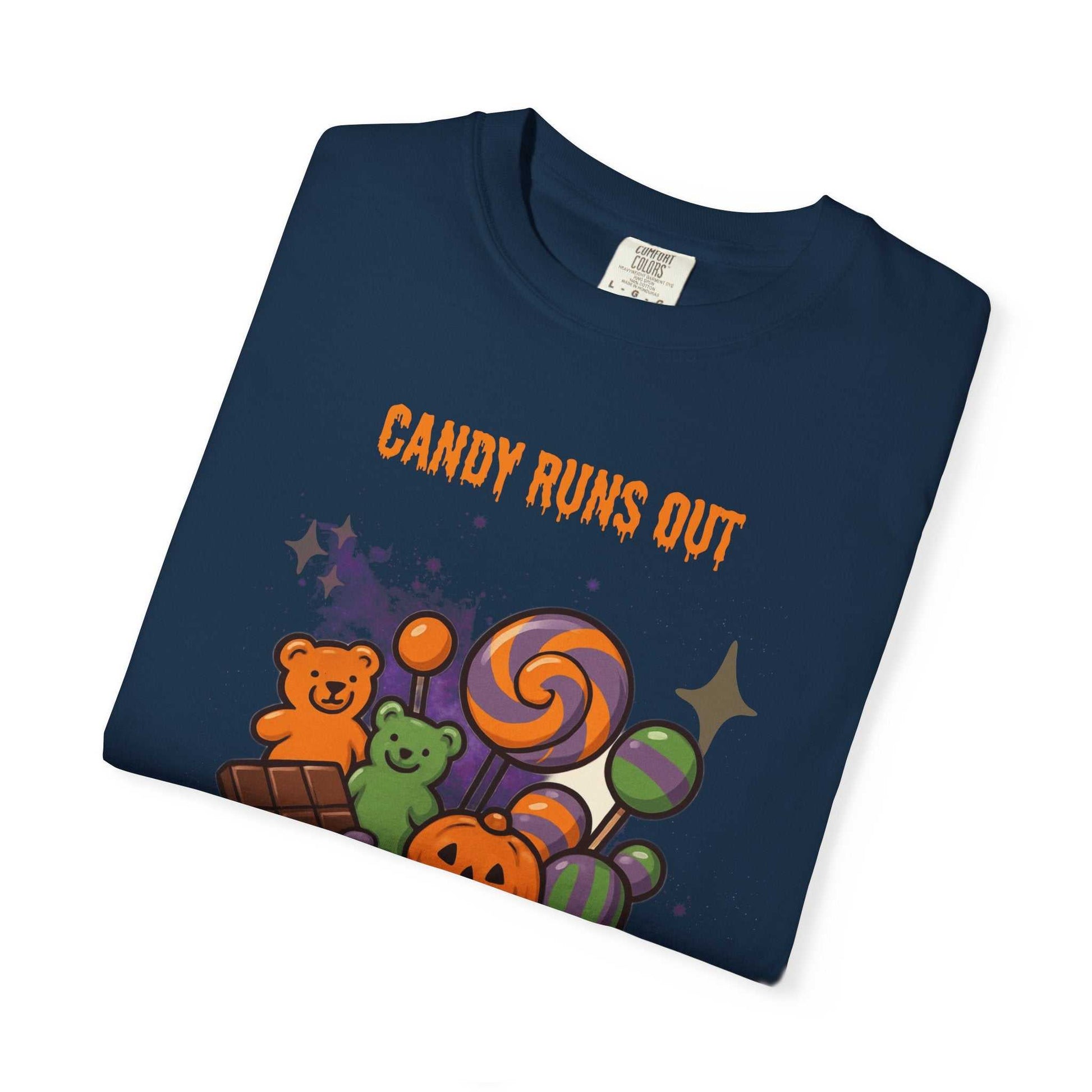 A navy t-shirt with a Halloween candy graphic and "Candy Runs Out" text.
