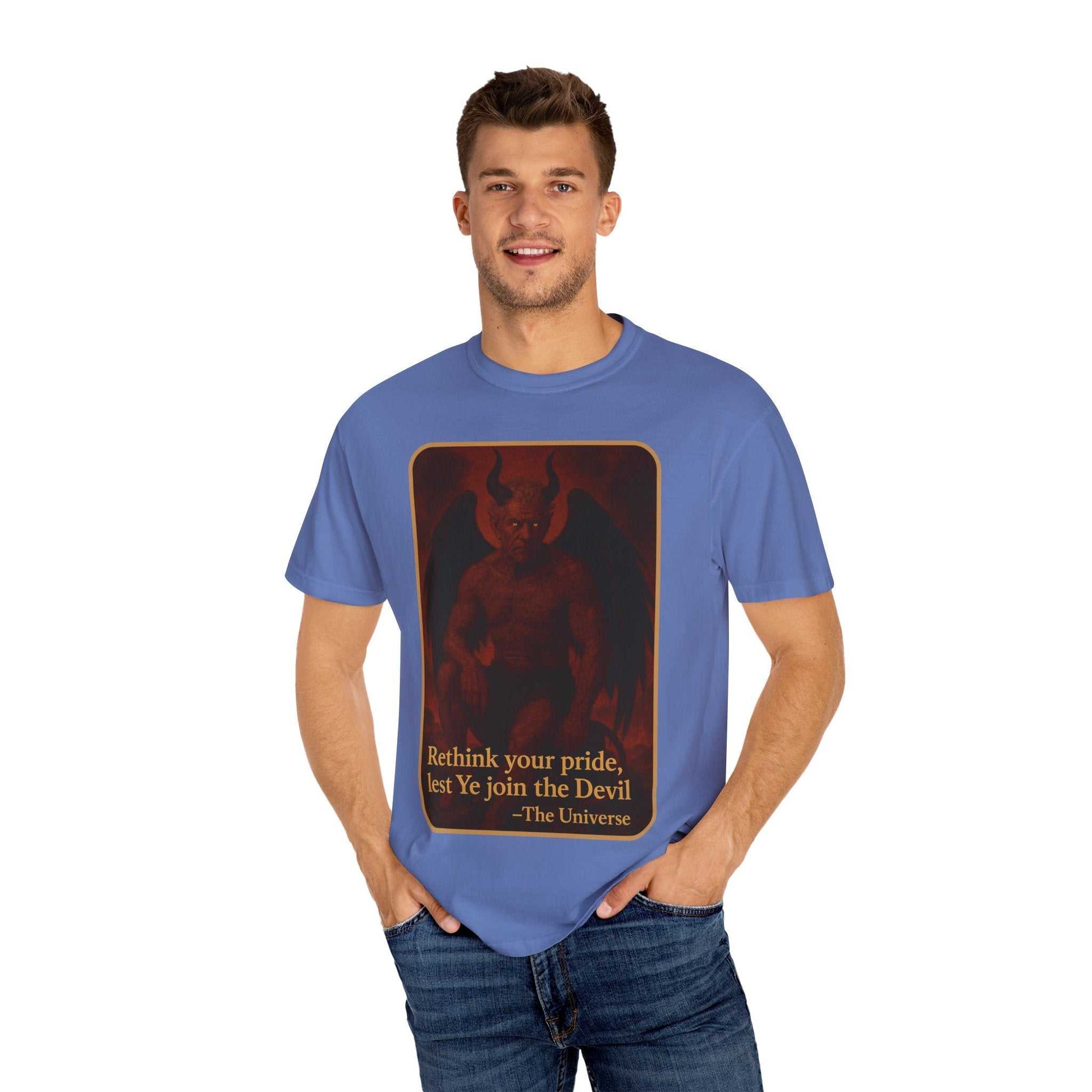 Man wearing blue Devil Rethink Your Pride unisex garment-dyed cotton t-shirt with devil graphic and text on front