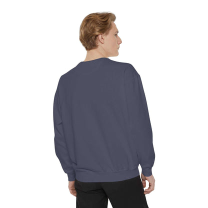 Back view of a man wearing a dark blue crewneck sweatshirt.