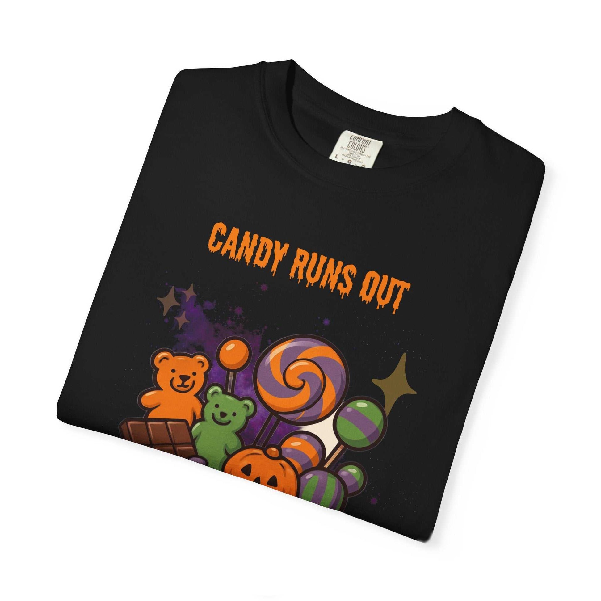 Black t-shirt with "Candy Runs Out" text and Halloween candy graphic.