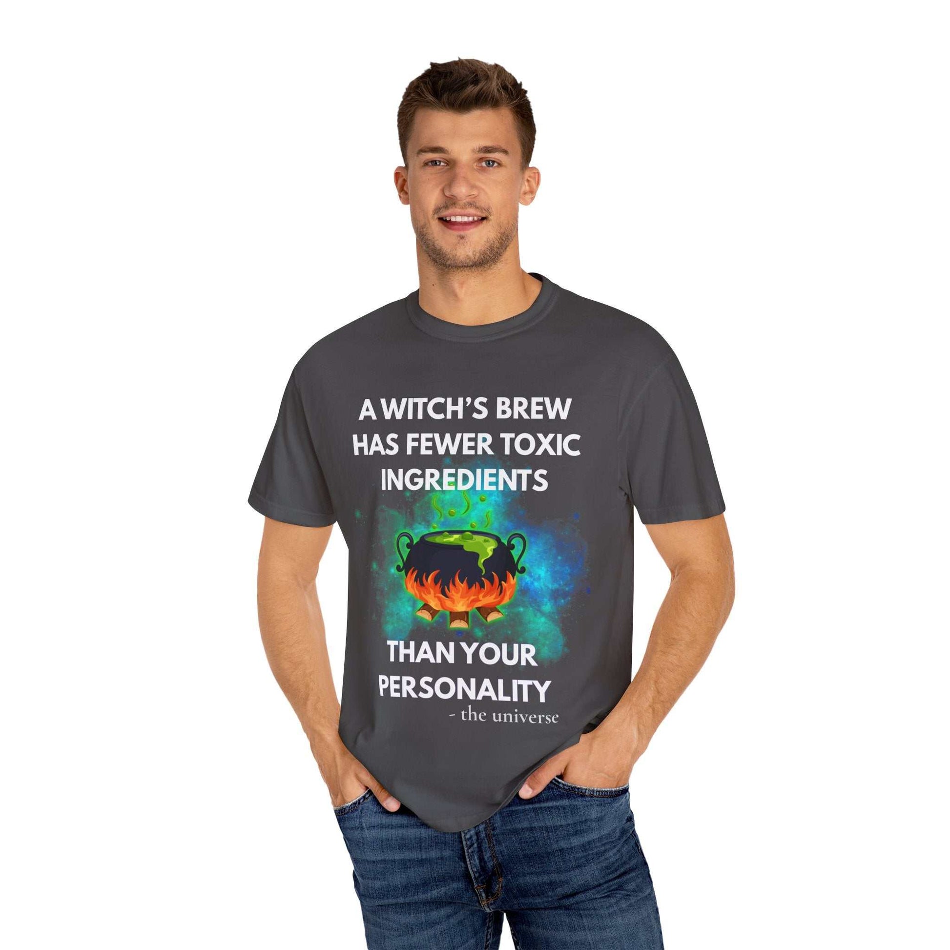 A dark grey t-shirt with a witch's cauldron design and text.
