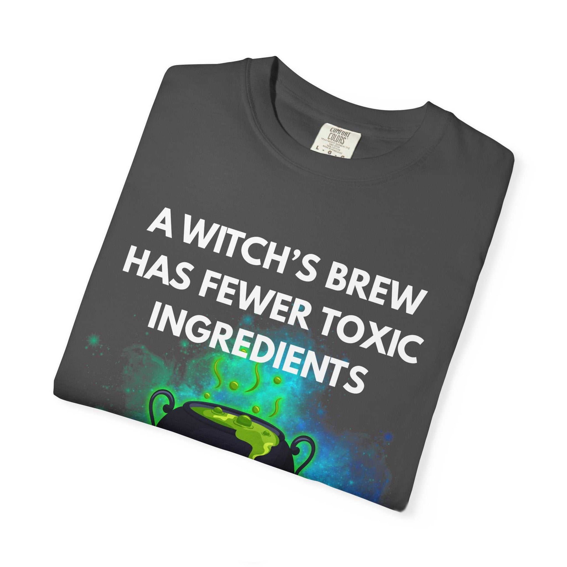 A dark grey t-shirt with a witch's brew design and text.