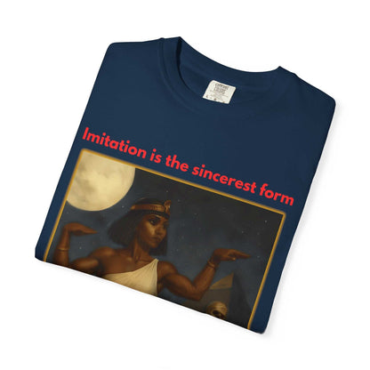 Folded navy blue Egyptian Mummy T-Shirt with Cleopatra and pyramid design and red text "Imitation is the sincerest form"
