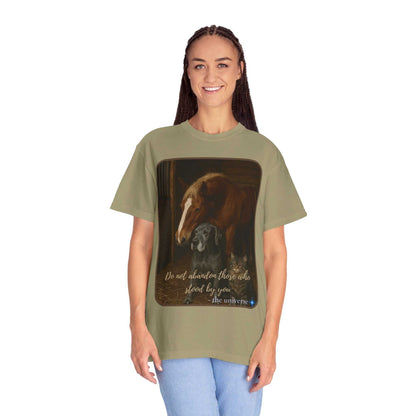 Woman wearing olive green Comfort Colors 1717 Animal Rescue T-Shirt featuring horse and dog illustration with "Do Not Abandon Those Who Stood By You" text