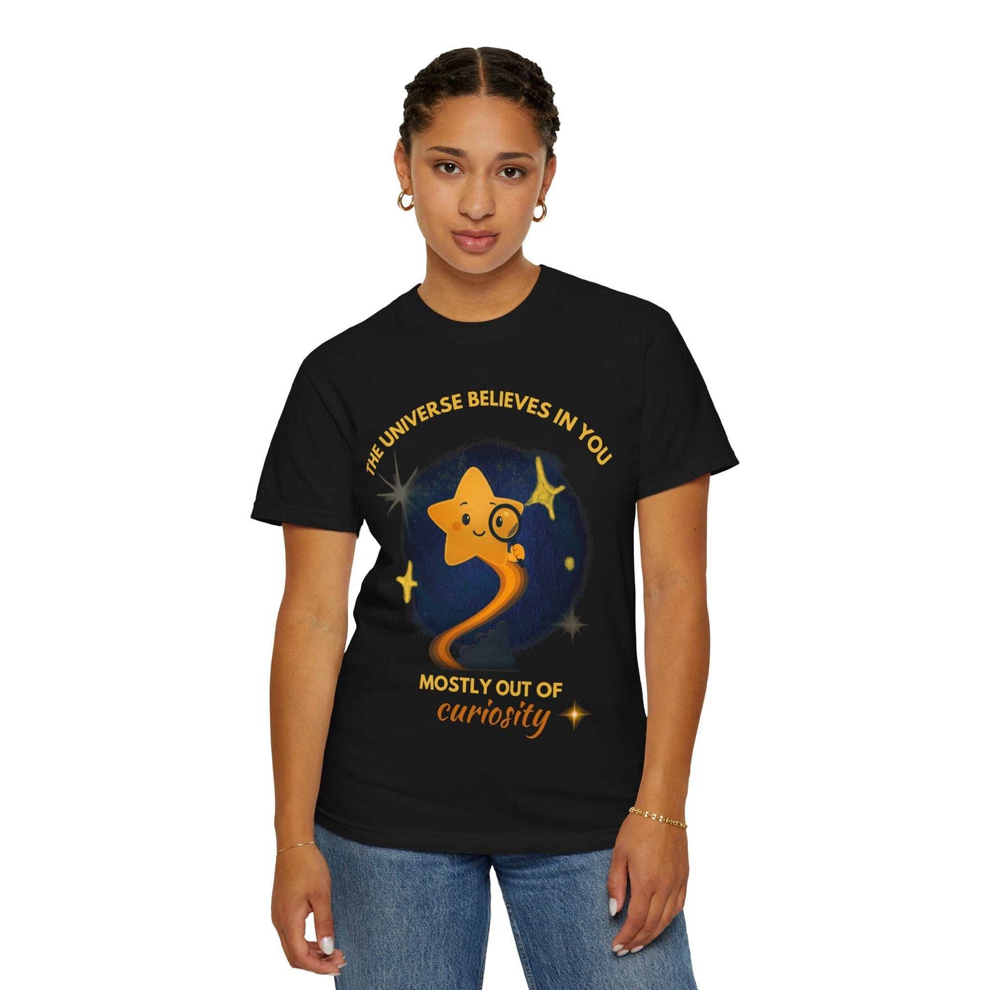 Black t-shirt with a graphic of a star and the text "The Universe Believes in You".