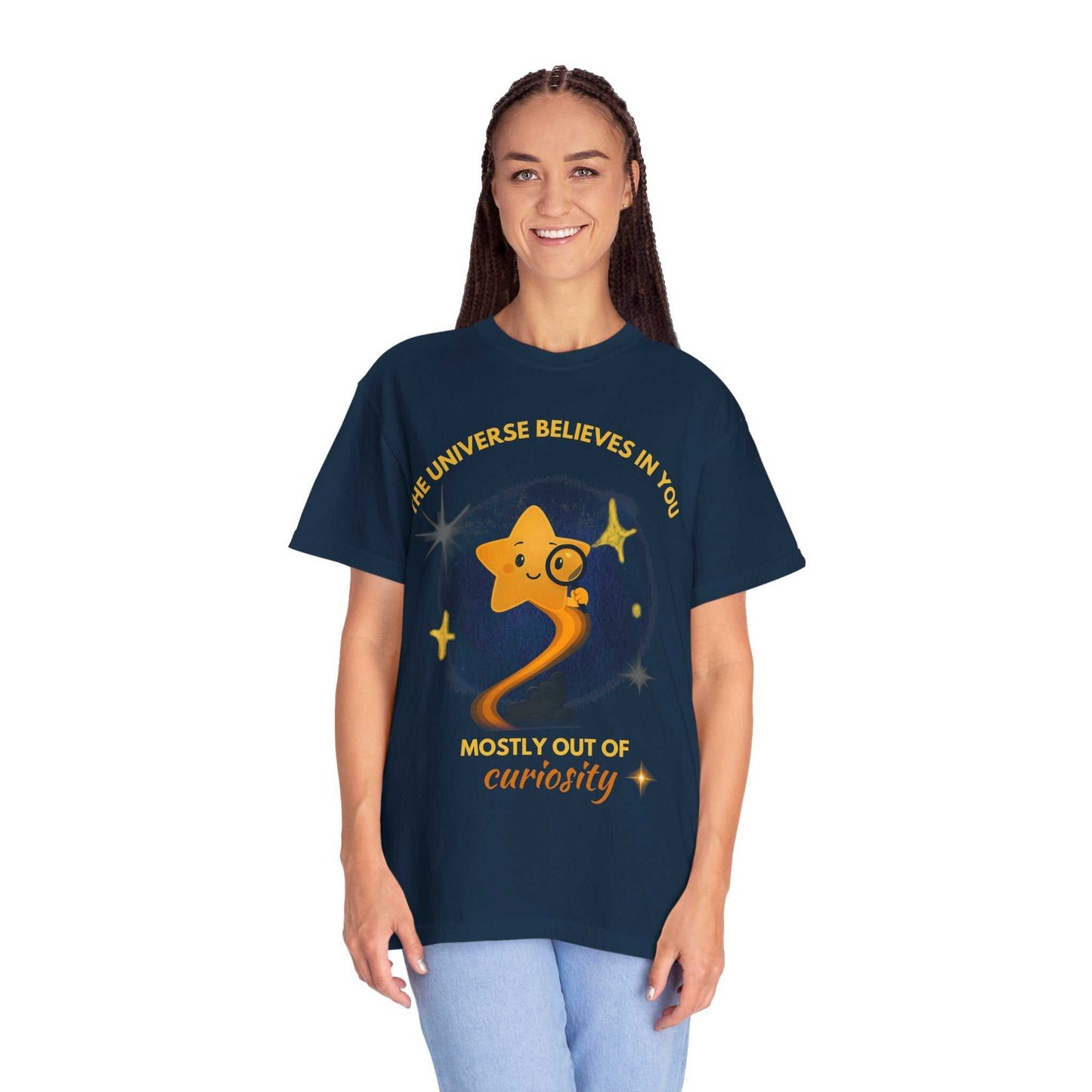 A navy t-shirt with a graphic of a star and the text "The Universe Believes in You".