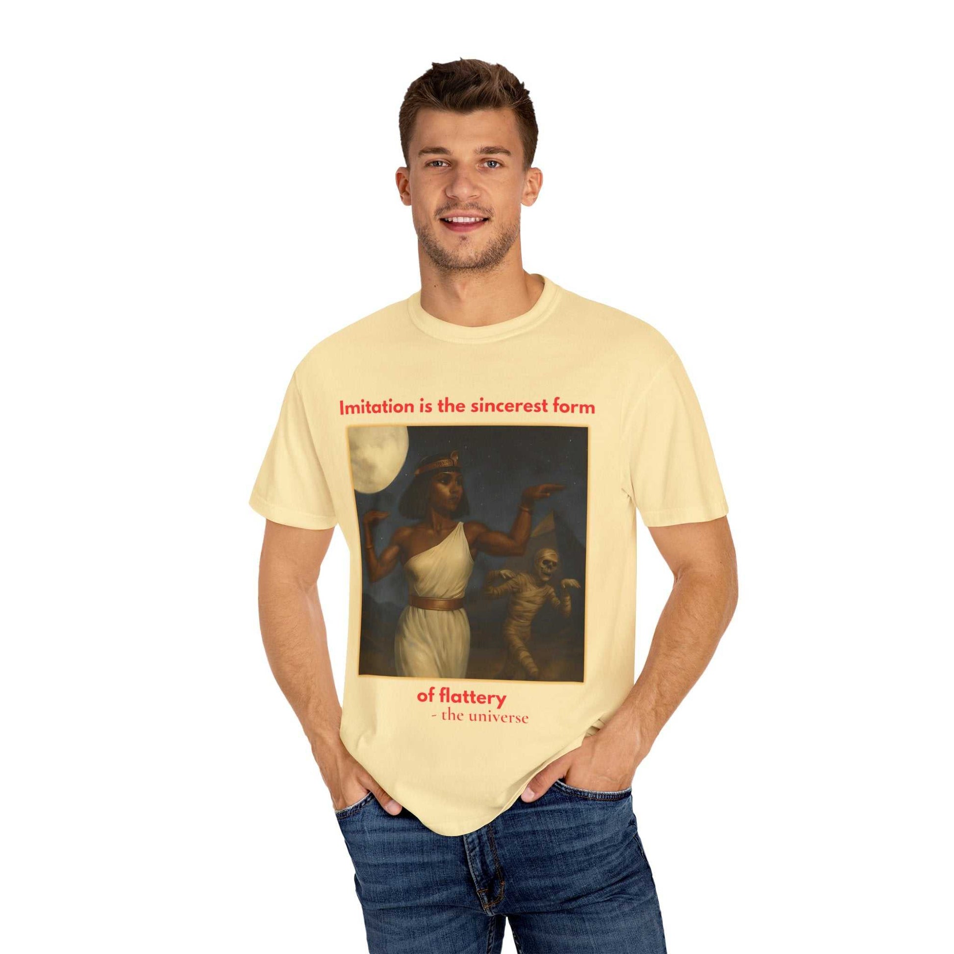 Man wearing beige Egyptian Mummy T-Shirt featuring Cleopatra and mummy graphic with text design