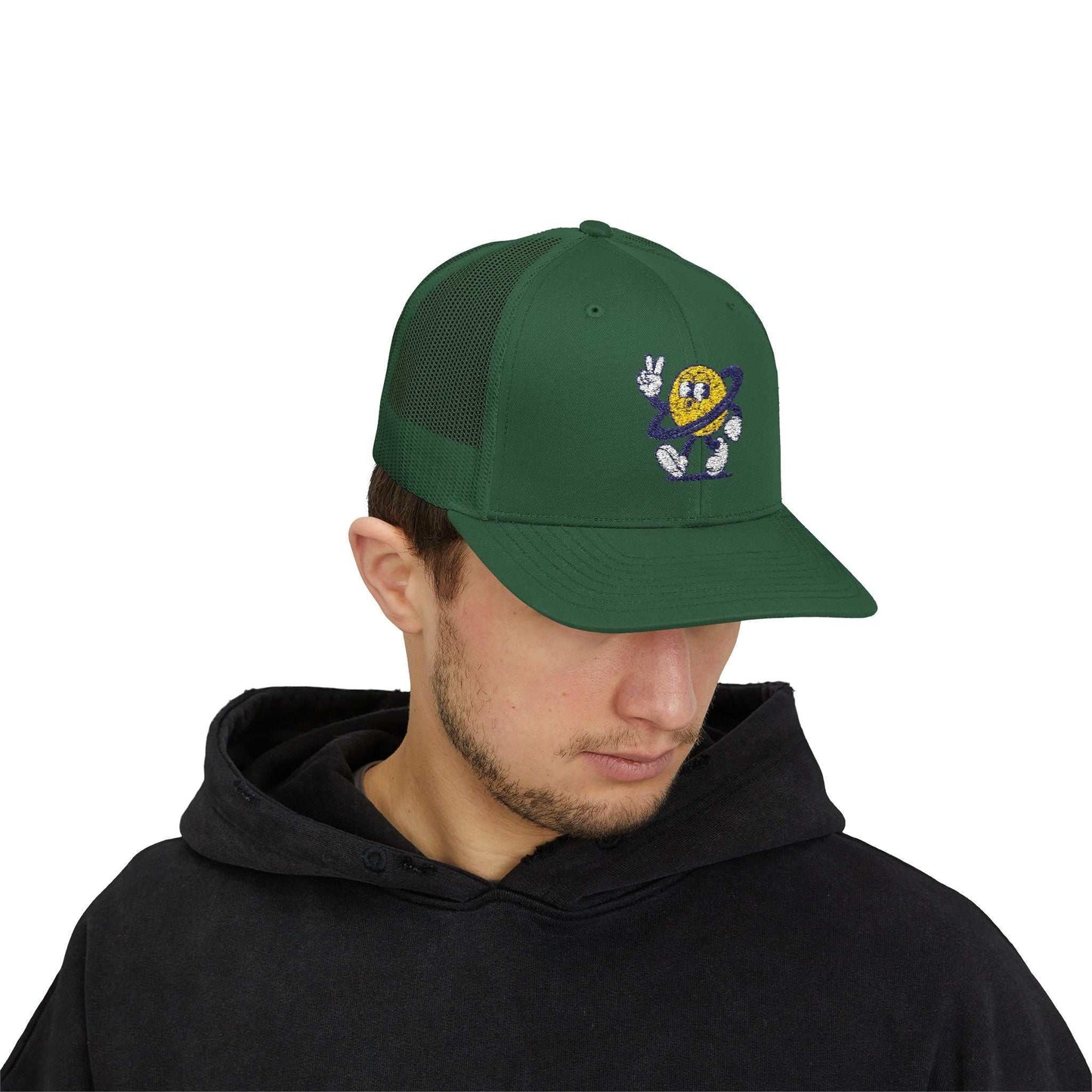 Young man wearing green Planet Smile Trucker Cap with retro cartoon space patch and mesh back