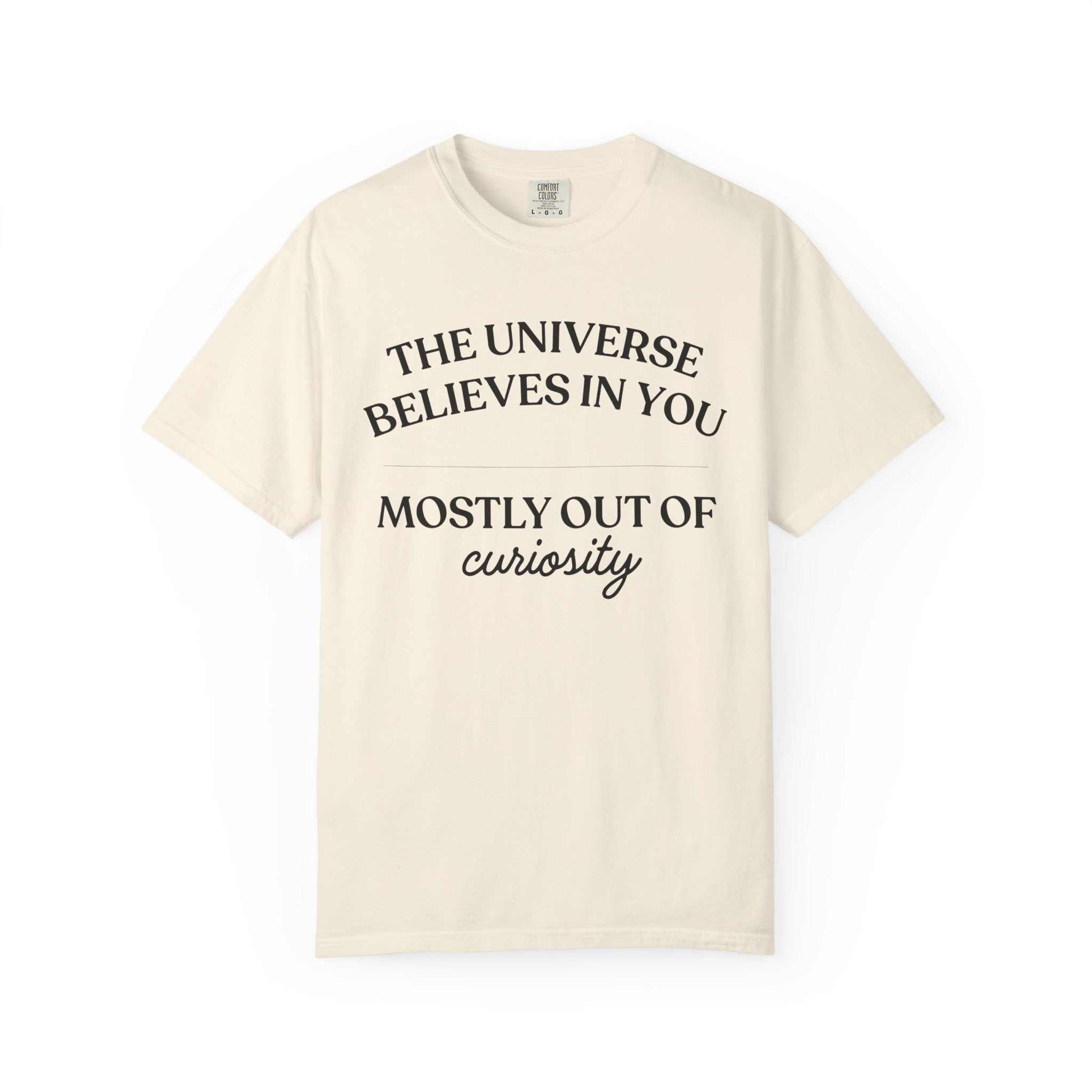 Comfort Colors cream graphic tee with 'The universe believes in you mostly out of curiosity' text