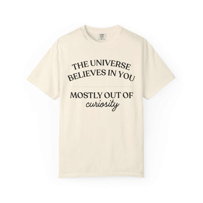 Comfort Colors cream graphic tee with 'The universe believes in you mostly out of curiosity' text