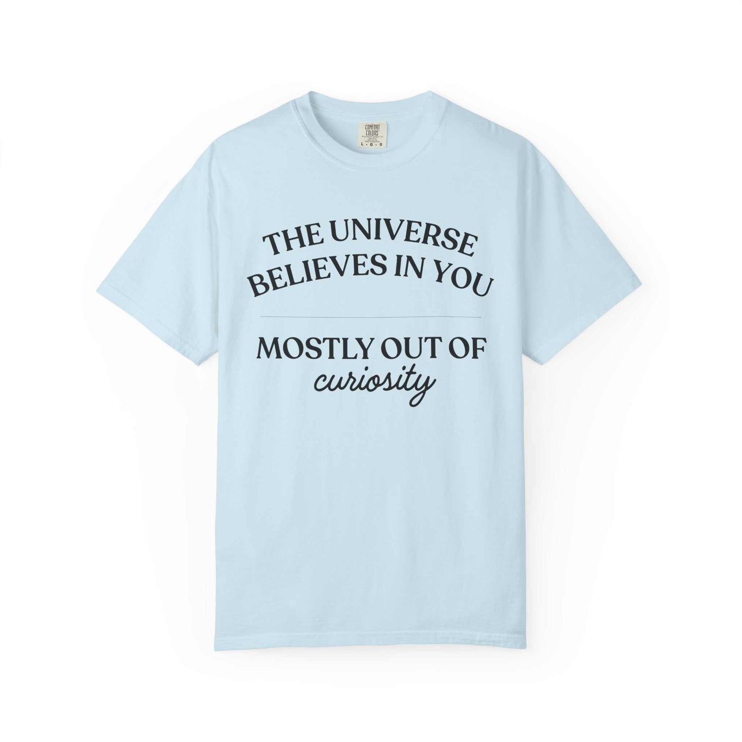 Light blue Comfort Colors graphic tee with 'The Universe Believes in You Mostly Out of Curiosity' text