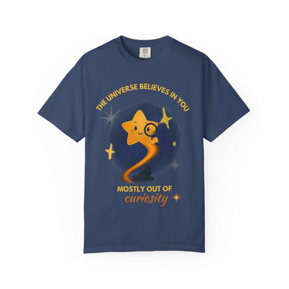 A navy blue t-shirt with a graphic of a star looking through a magnifying glass.