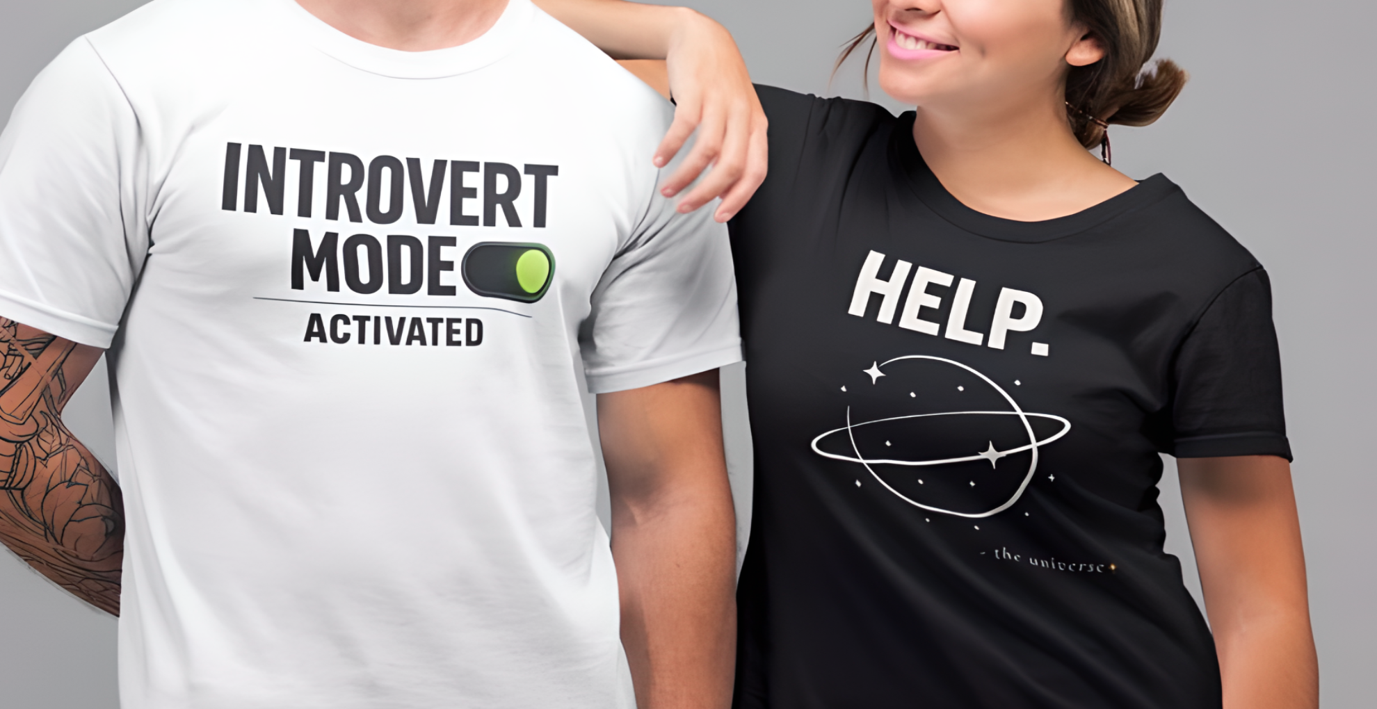 Two people wearing t-shirts with humorous text designs on a gray background