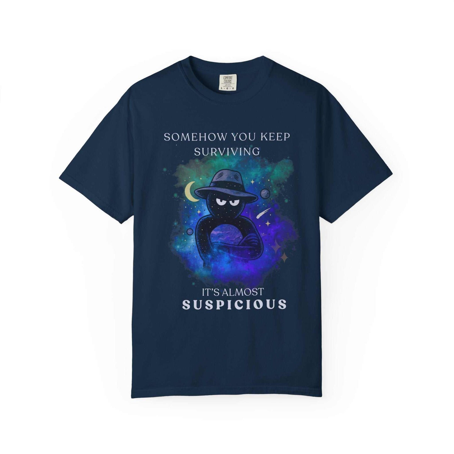 Navy t-shirt with galaxy background, mysterious figure, and text 'Somehow you keep surviving, it's almost suspicious' from Youniverses.